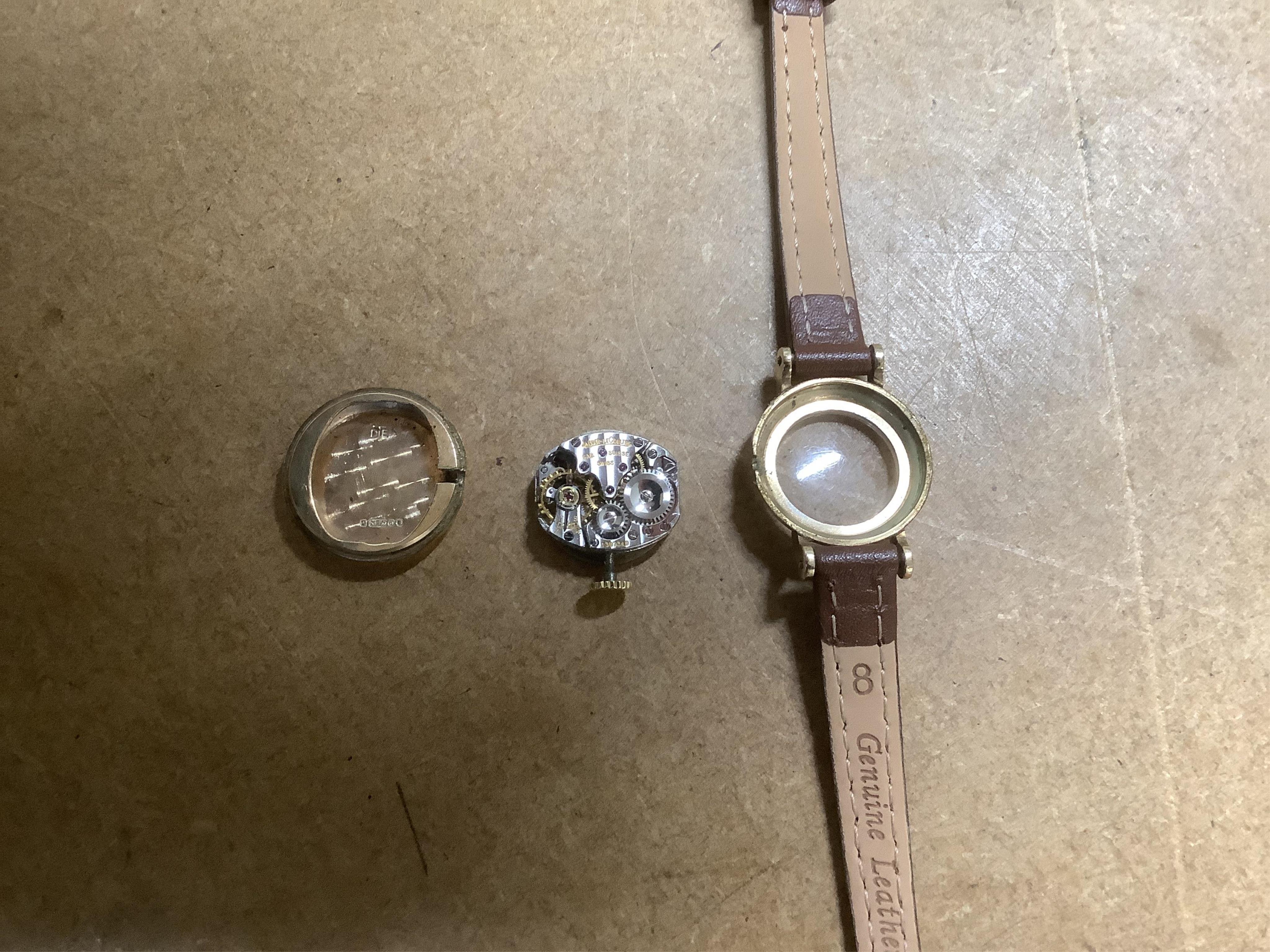 A lady's 9ct gold Jaeger LeCoultre manual wind wrist watch, with baton and quarterly Arabic numerals, cased diameter 20mm, on an associated leather strap, no box or papers.